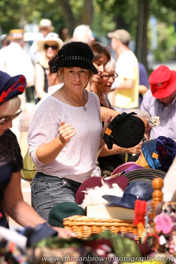There's my girl, at the hat stall photograph